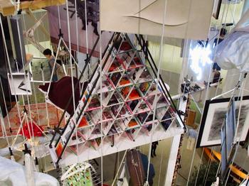 A crafty use of old <em>Flash Art</em> magazines, showing the art world as a house of cards. The piece, titled 'Strategies,' is from 1990.